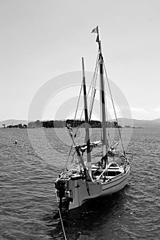 Black and white boat in the sea at Eretria Euboea Greece