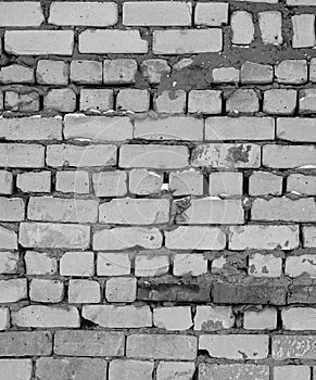 Black and white Brick Wall. Large gaps between the bricks