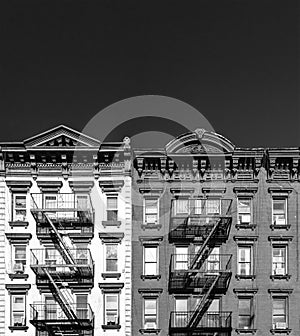 Black and white buildings with empty dark sky background in New York City