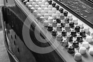 Black and white buttons on button accordion close-up