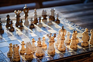 Black and white carved wooden chess pieces.