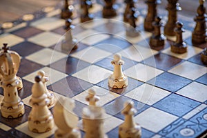 Black and white carved wooden chess pieces.