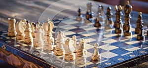 Black and white carved wooden chess pieces.