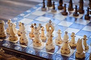 Black and white carved wooden chess pieces.