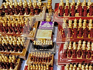 Black and white carved wooden chess pieces