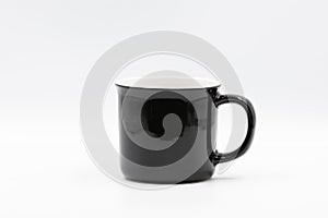 Black and white ceramic mug standing on white background