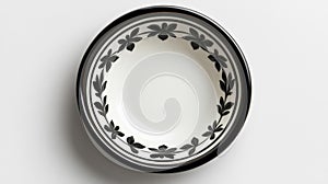 Black and White Ceramic Plate with Intricate Leaf Design Isolated on White Background photo