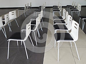 Black and white chairs rows in conference and presentation hall