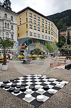 Black and white checkerboard on the square in Zell am See.