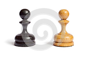 Black and white chess pawns on a white background.