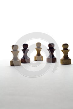 Black and white chess pawns on a white background