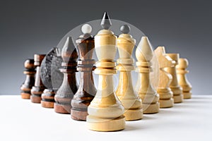Black and white chess pieces on a table