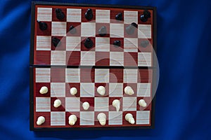 Black and white chess stand on a chessboard