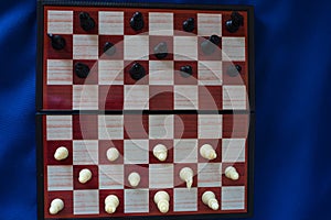 Black and white chess stand on a chessboard