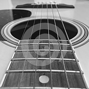 A Black and White Close-Up of Acoustic Guitar Strings