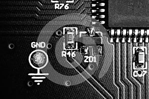 Black and white close up for ground test point next to microcontroller