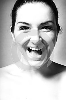 Black and white close up of a happy woman