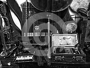 Black and white close up of musical instruments, antique shop Albania