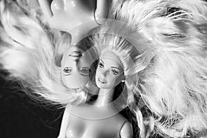 Black and white composition with Barbie dolls