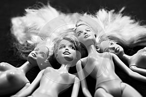 Black and white composition with Barbie dolls