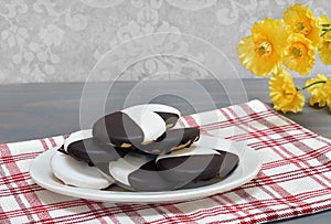 Black and White cookies on an oval platter, stacked