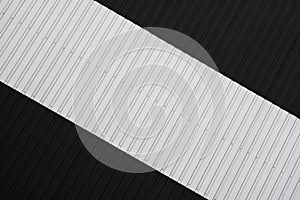 Black and white Corrugated metal sheet texture surface of the wall. Galvanize steel background.