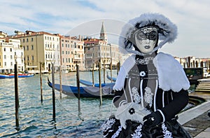 Black and white costumed masked woman