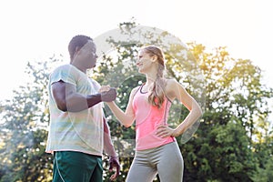 Black-white couple getting some motivation for sport exercise