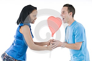 Black and white couple with hearth lollypop