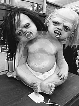 Black and white creepy double head baby doll