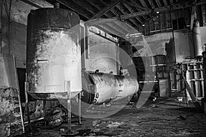 Black and White Decaying Cannery Warehouse Interior with Rusted Machinery