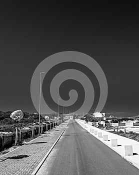 Black and white of Desert road near sardinian beach