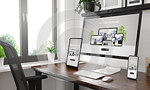 black and white desktop with three devices showing responsive website photo