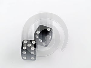 Black and white dice falling