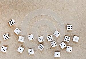 black and white dice framing the side of a neutral surface