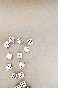 black and white dice framing the side of a neutral surface