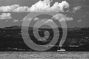 Black white dramatic seascape Adriatic sea and lonely boat