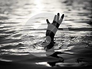 Black and white of Drowning victims, Hand of drowning man needing help. photo