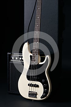 Black and white electric bass guitar, hard case