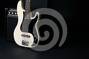 Black and white electric bass guitar, hard case