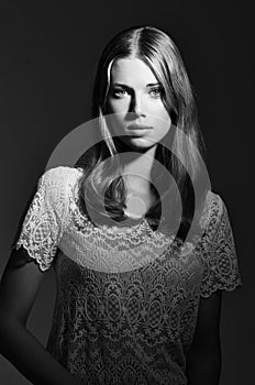 Black and white, fashion and portrait of woman on dark background with beauty, style and trendy clothes. Monochrome