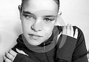 Black & white fashion style portrait of young athletic woman.wearing sportswear on white background