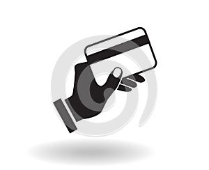 black and white flat vector icon hand holding credit card illustration with shadow, concept of paying by card