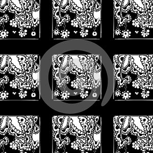 Black and white floral doodle pattern on black background
