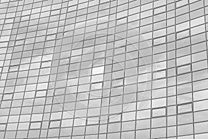 Black and white fragment of a modern office building. Abstract geometric background. Part of the facade of a skyscraper