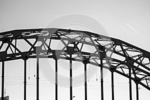 Black and white fragment of a railway bridge support in the form of an arch