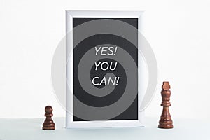 The black-and-white frame says Yes you can