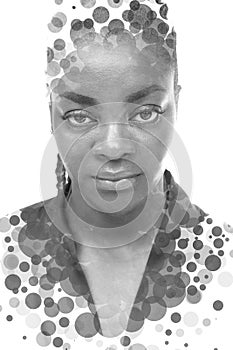 A black and white full face portrait of a woman combined with circles in a double exposure technique.