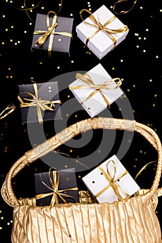 Black and white gift boxes with gold ribbon