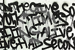 Black and white graffiti drawing from random words in a beautiful font on the wall as decoration or decoration